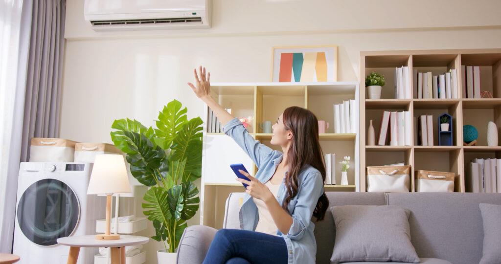 Homeowner enjoying cool air from recently repaired AC unit